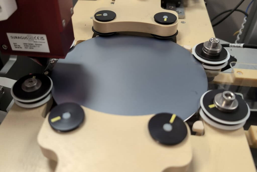 Semiconductor wafer rotation mechanism for mapping devices with a non-contact eddy current sensor measuring the sheet resistance, thickness or resistivity
